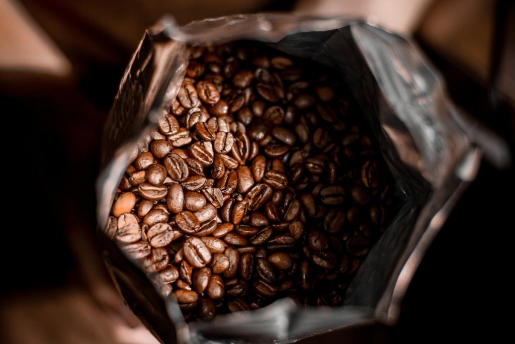 Coffee Branding: Achieving sustainable coffee packaging 6 open coffee beans in packaging scaled e1625339238831
